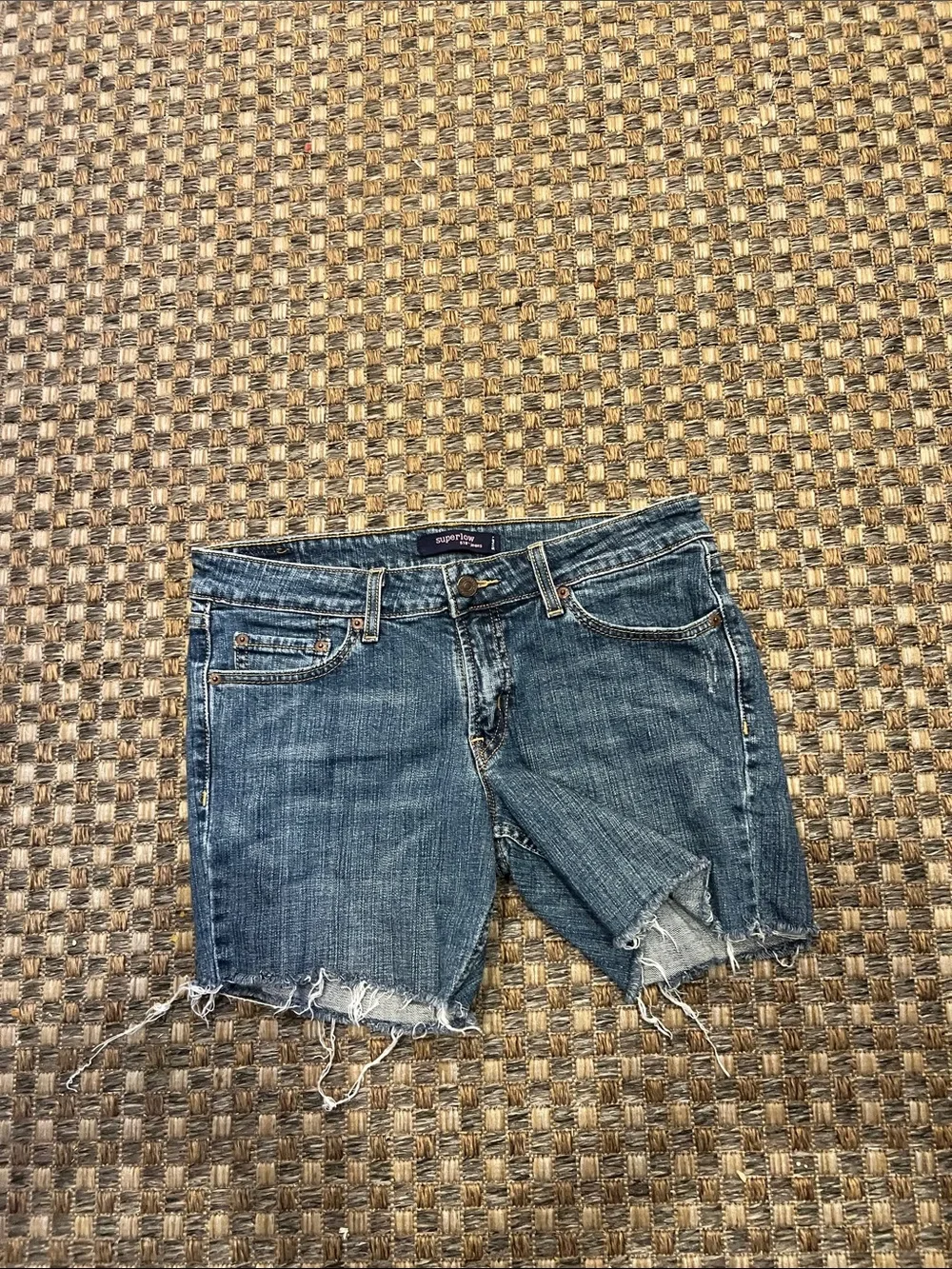 Levi's light blue denim shorts with frayed hem